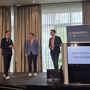 Veranstaltung Ultima Media Germany zusammen mit Patrick Säckler und Tagungsleiter Jörg Holzhäuser
